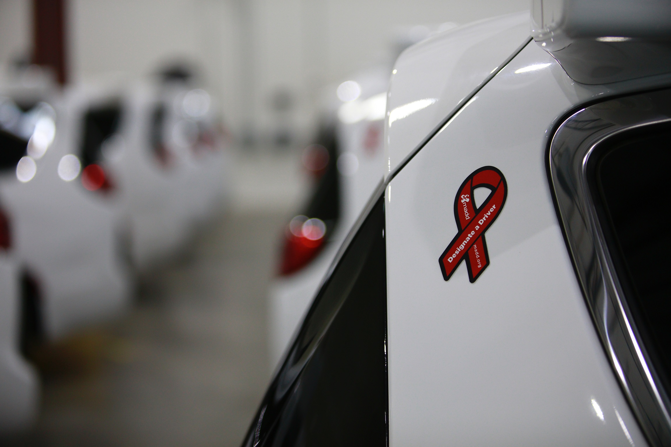 The red ribbons on Waymo's fleet of self-driving vehicles are part of MADD's Tie One On for Safety holiday campaign.