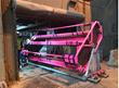 A custom-designed pink frame holds one of the 12-foot-tall acrylic tanks. Credit: LZ Collaboration