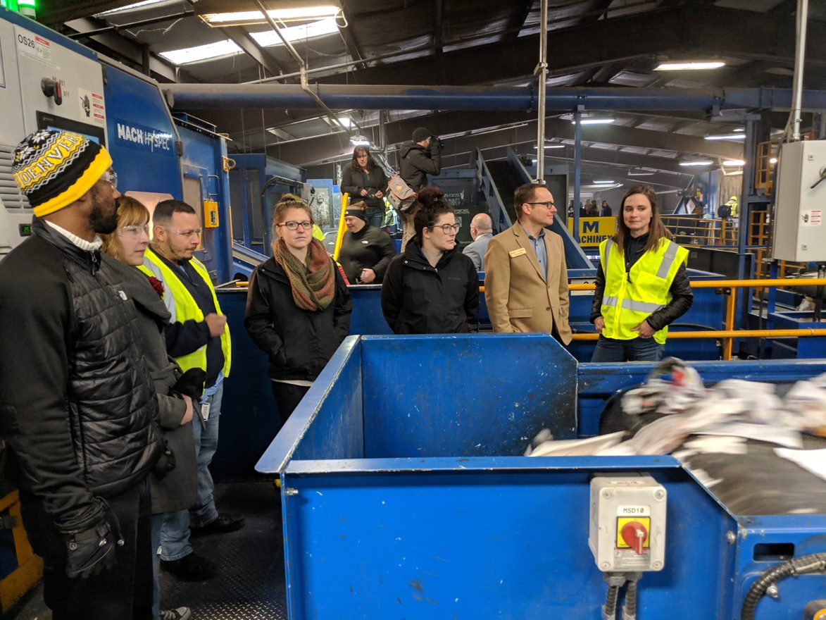 Council members and community stakeholders take a tour of Alpine Waste & Recycling in Denver to learn how paper cups are being sorted.