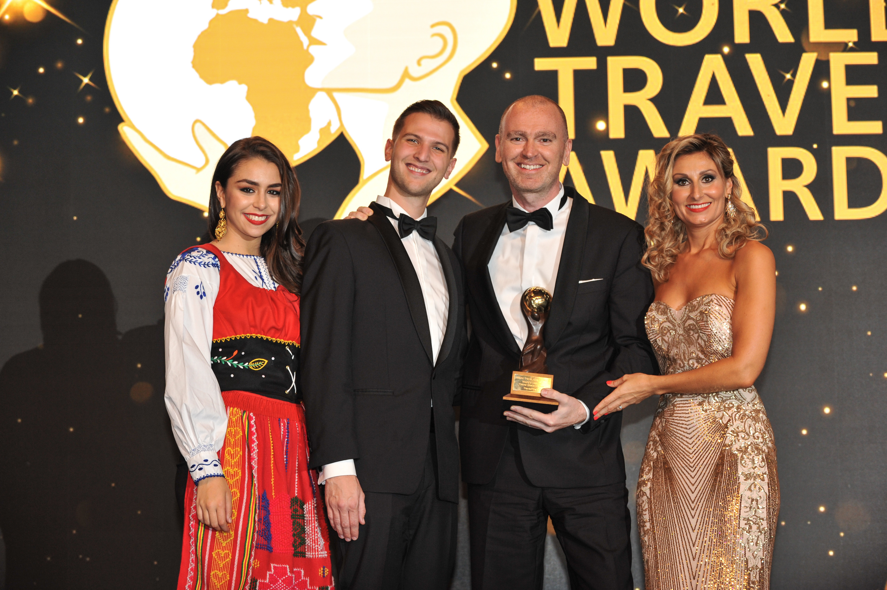 Calvin Iverson (left), Senior PR Manager, and Phil Salcedo (right), VP, North America, accept the award for World's Leading Travel Deals Website at the 2018 World Travel Awards in Lisbon on Saturday.