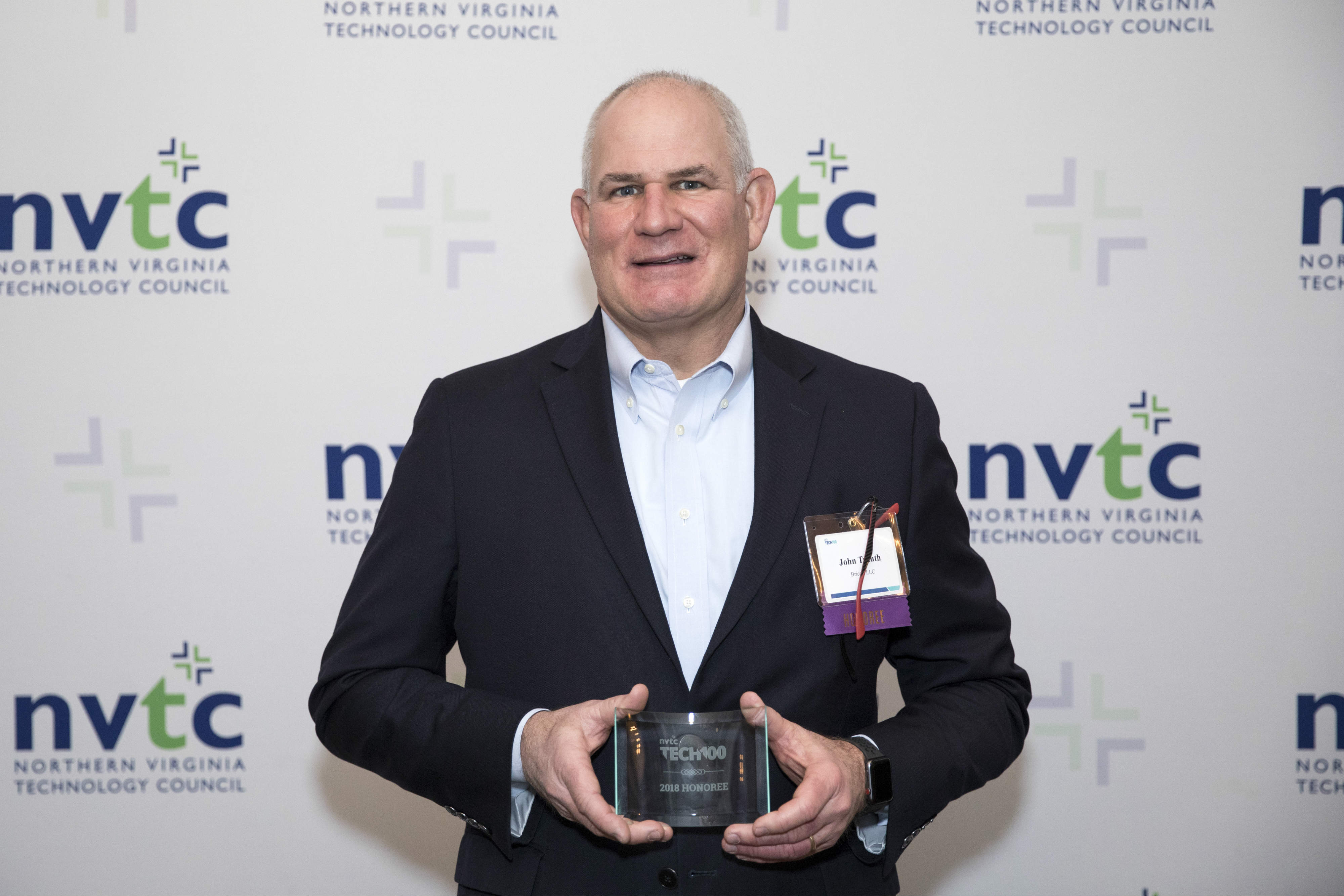 Bricata CEO John Trauth accepts the NVTC Tech 100 plaque at an event hosted by the  Northern Virginia Tech Council