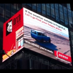 Arch Auto Parts' video billboard in Times Square features DENSO spark plugs, and shows that no matter the weather, 'With DENSO, You're ready.'