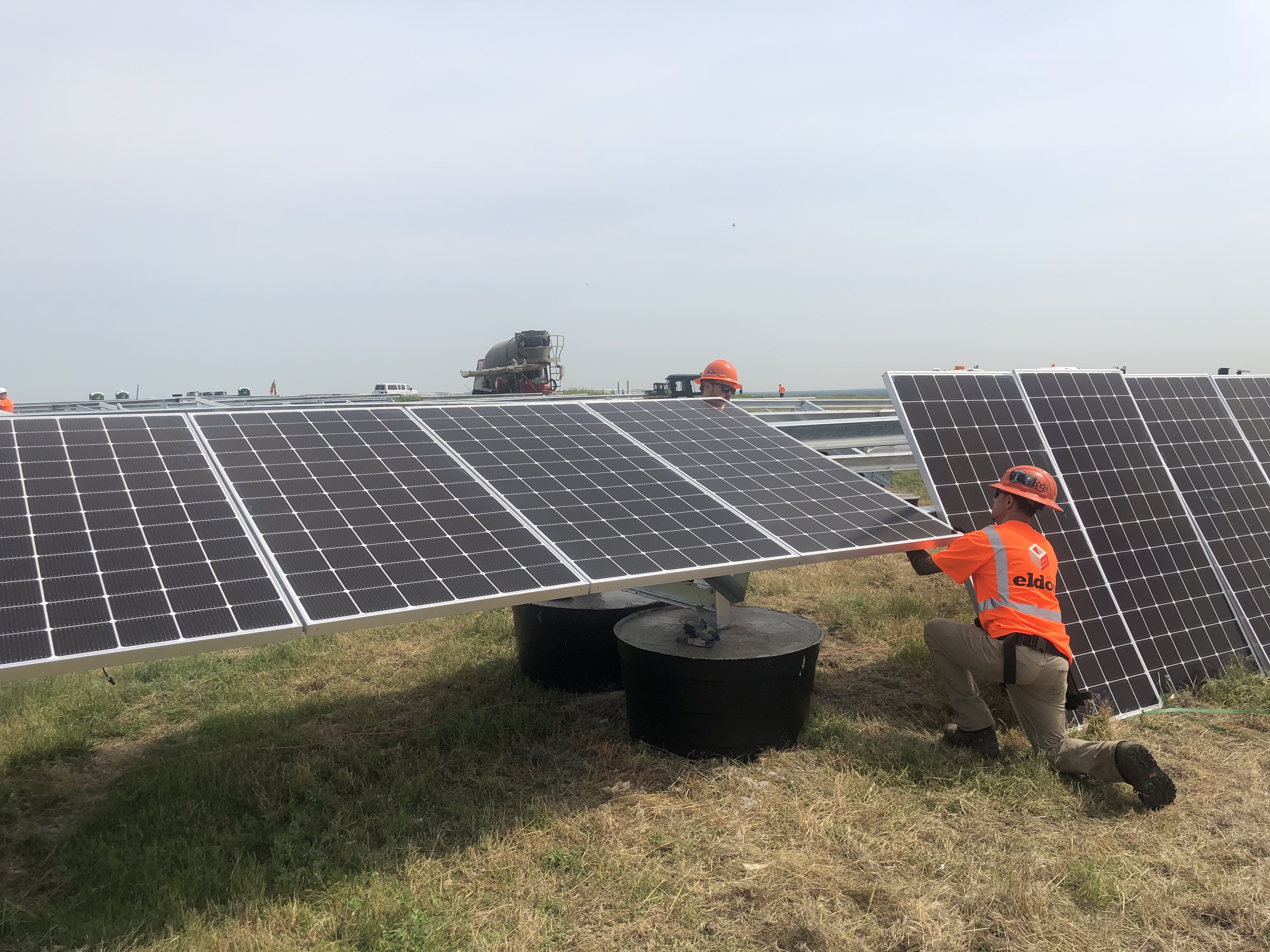 Workers Installing Solar Panels at Islip Project Site