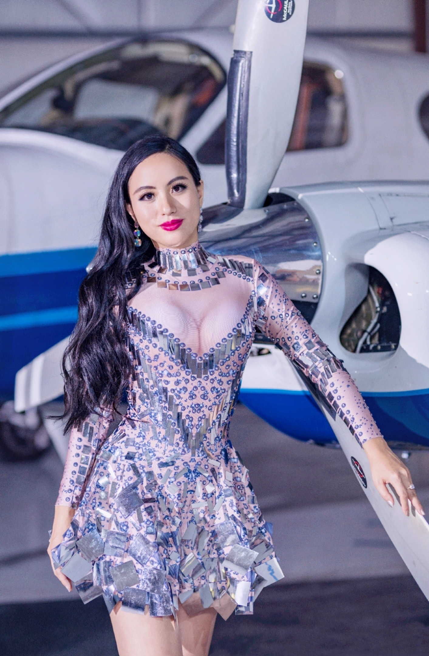 Jennifer Zhang Wearing her Costume Posing with Private Jet in Flying High's Music Video