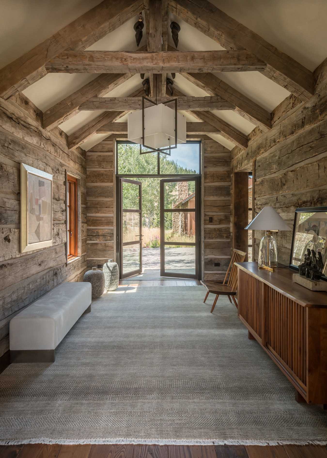 Using reclaimed materials as in these hewn trusses, JLF Architects partners with Big-D Signature in a design-build philosophy that produces timeless, custom homes (photo by Audrey Hall).