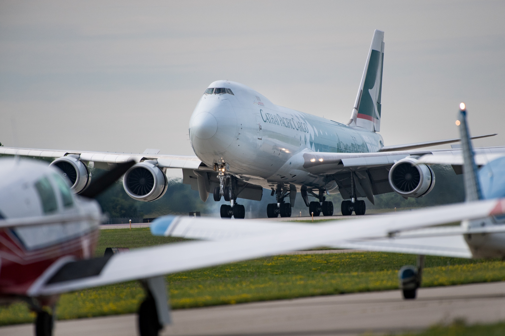 A Cathay Pacific 747-8 cargo aircraft lands at Oshkosh, Wisconsin, for EAA AirVenture Oshkosh 2016. (EAA photo/Jim Koepnick)