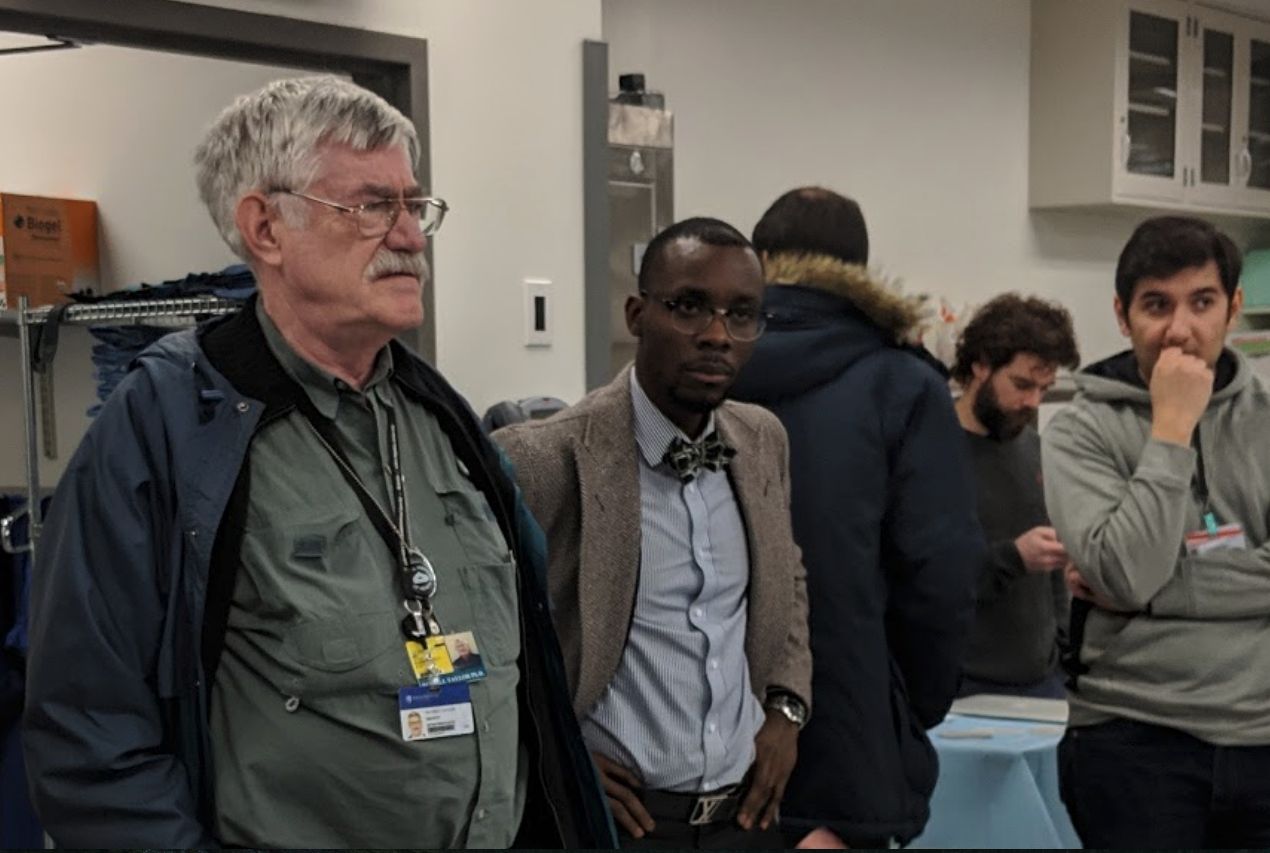 Professor Russell Taylor (left) and Julius Oni, MD (center), engaged in understanding how instant 3D images are formed