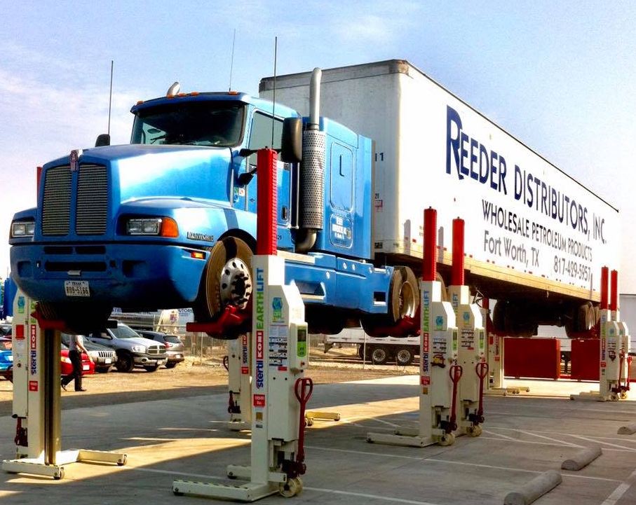 Reeder Distributors Inc. sells Stertil-Koni products to Texas and surrounding states. Here a company truck sits atop the green Mobile Column EARTHLIFT