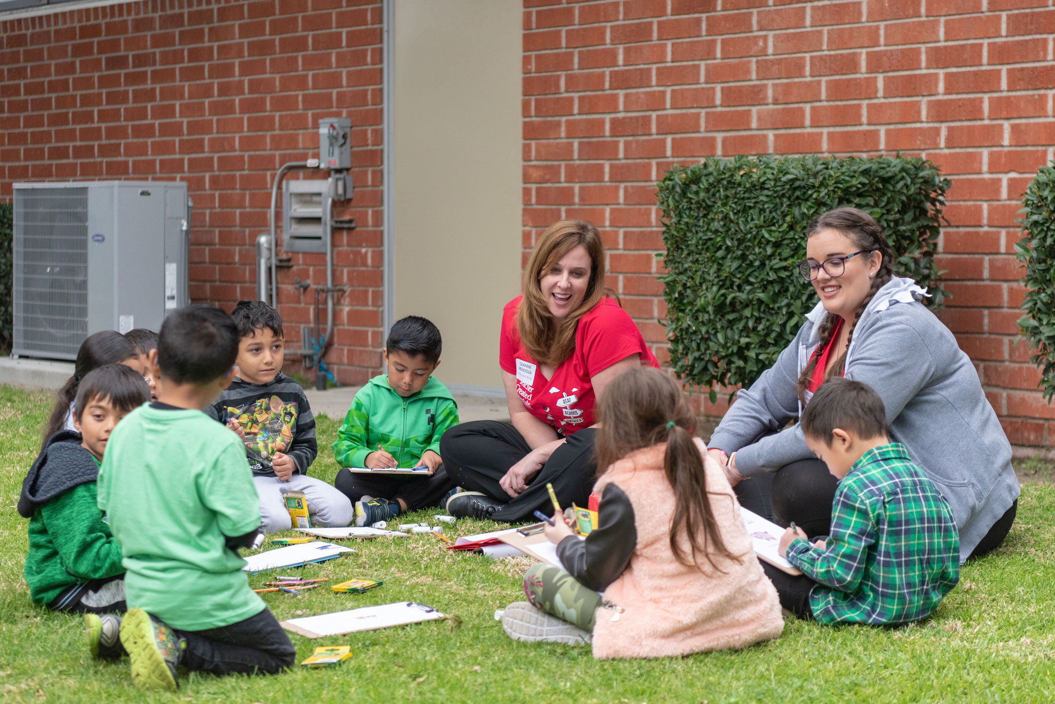 Deanne Mendoza (left) and Michelle Jovin (right) help students write their own version of Green Eggs and Ham.
