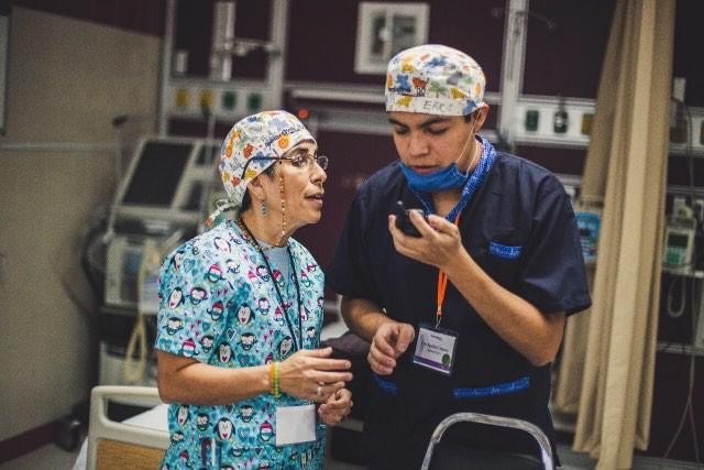 Photo courtesy of Ivan Ramirez. Arellano seen working along side the biomedical technician.