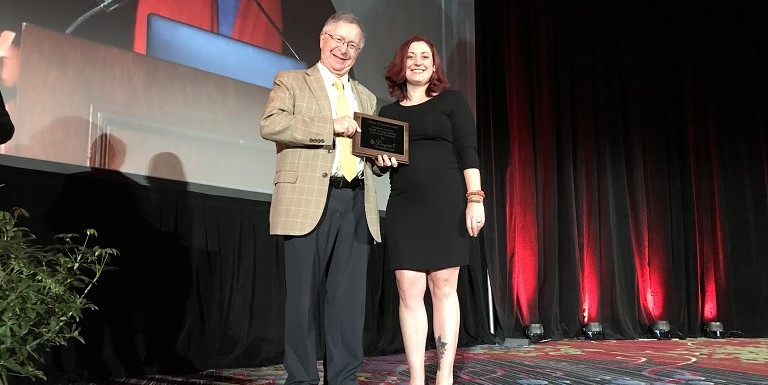 Dr. Richard Riegelman presents the Riegelman Award for Guided Learning Pathways to the Health Professions to College of Western Idaho representative, Rhonna Krouse.