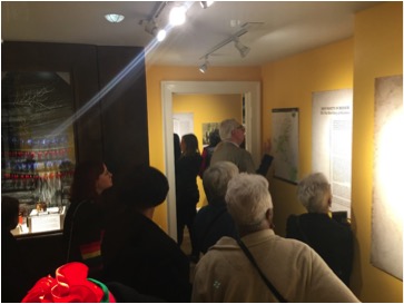 Visitors viewing the exhibit at the DeKalb History Center during the opening