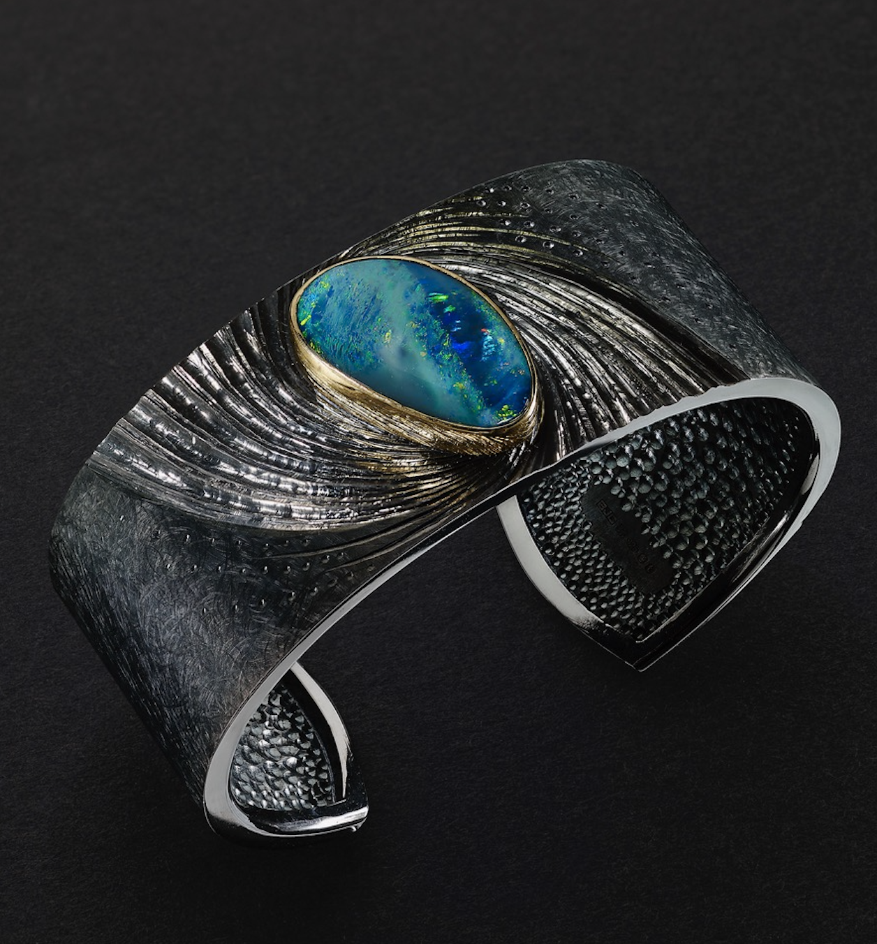 Alan Craxford, NewsCuff, silver, hand engraved and black rhodium plated, Australian Opal set in 22k gold.