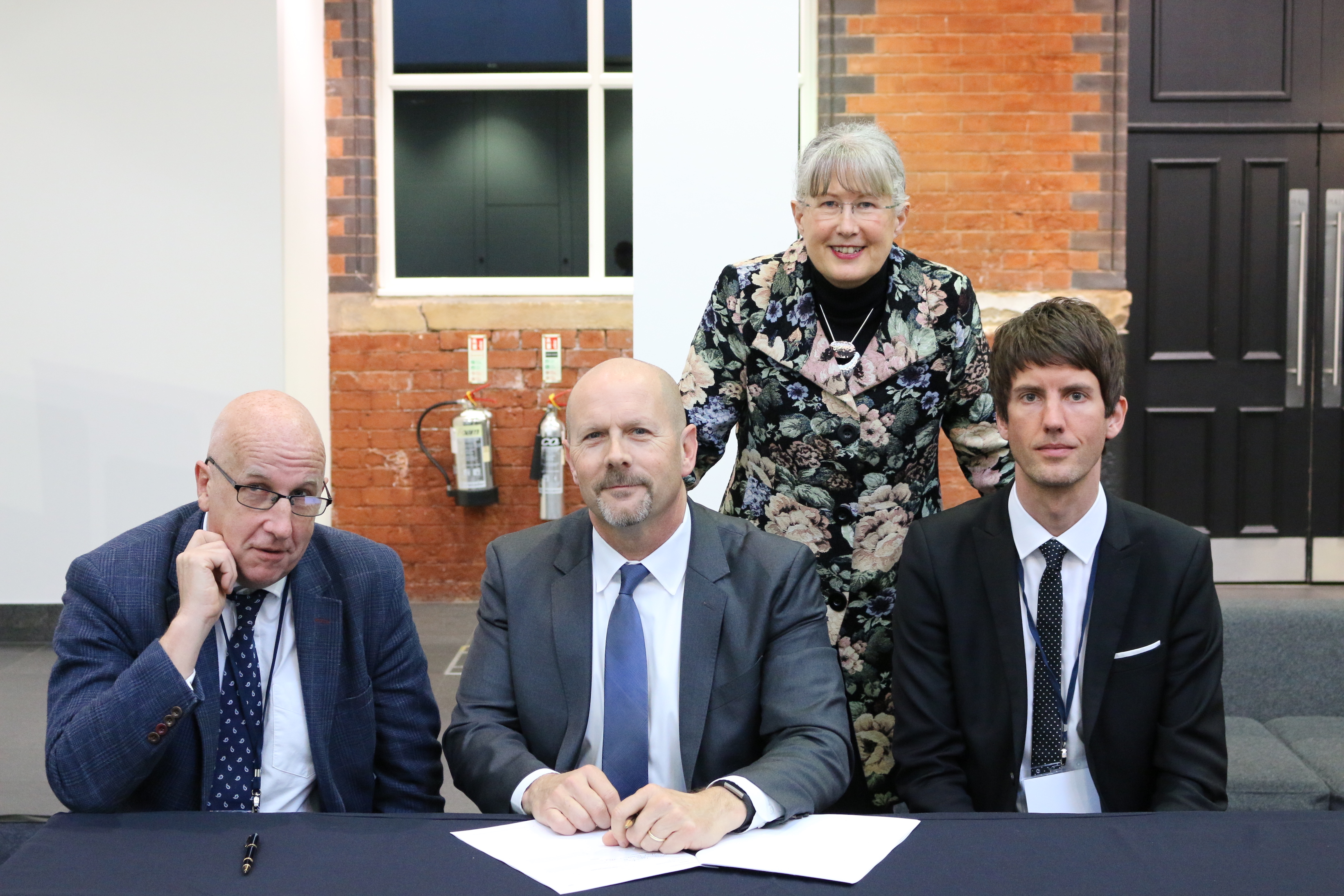 Representatives of Briovation, Health Innovation Manchester, and Manchester's Oxford Road Corridor sign the MOU Initiating an agreement to facilitate healthcare innovation in the UK and US.