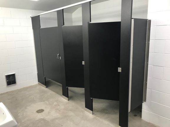 Scranton Products' Hiny Hiders partitions stand up to the tough sports environment of the university's new field house.
