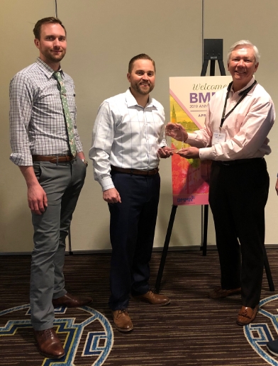 Conor Steadman and Jonathan Babbitt of MTA accept the BMMA Best in Class Provider Award from Ellis Hill of BMMA at the 2019 BMMA Annual Meeting in Charleston, SC.