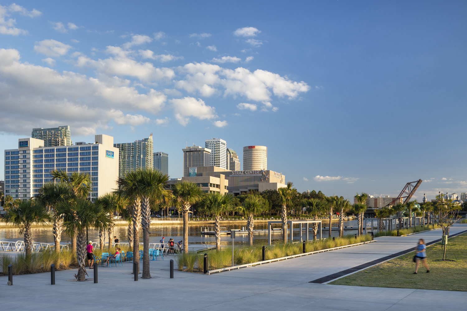 Julian B. Lane Riverfront Park helps unite the city of Tampa around the Hillsborough River including the palm tree-lined promenade designed by Civitas with skyline views offering clear sense of place.