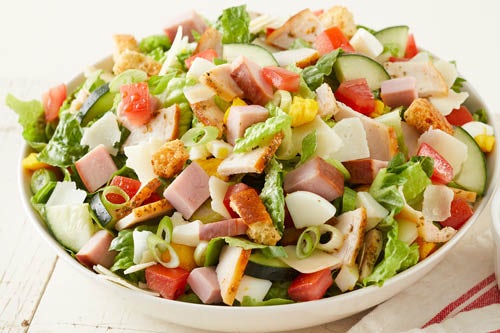 The Chef Salad features slow-roasted turkey, hickory-smoked ham, hard-boiled egg, cucumber, tomato, and other tasty toppings.