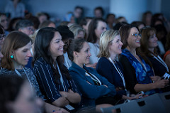 All female, racially diverse audience at a conference.