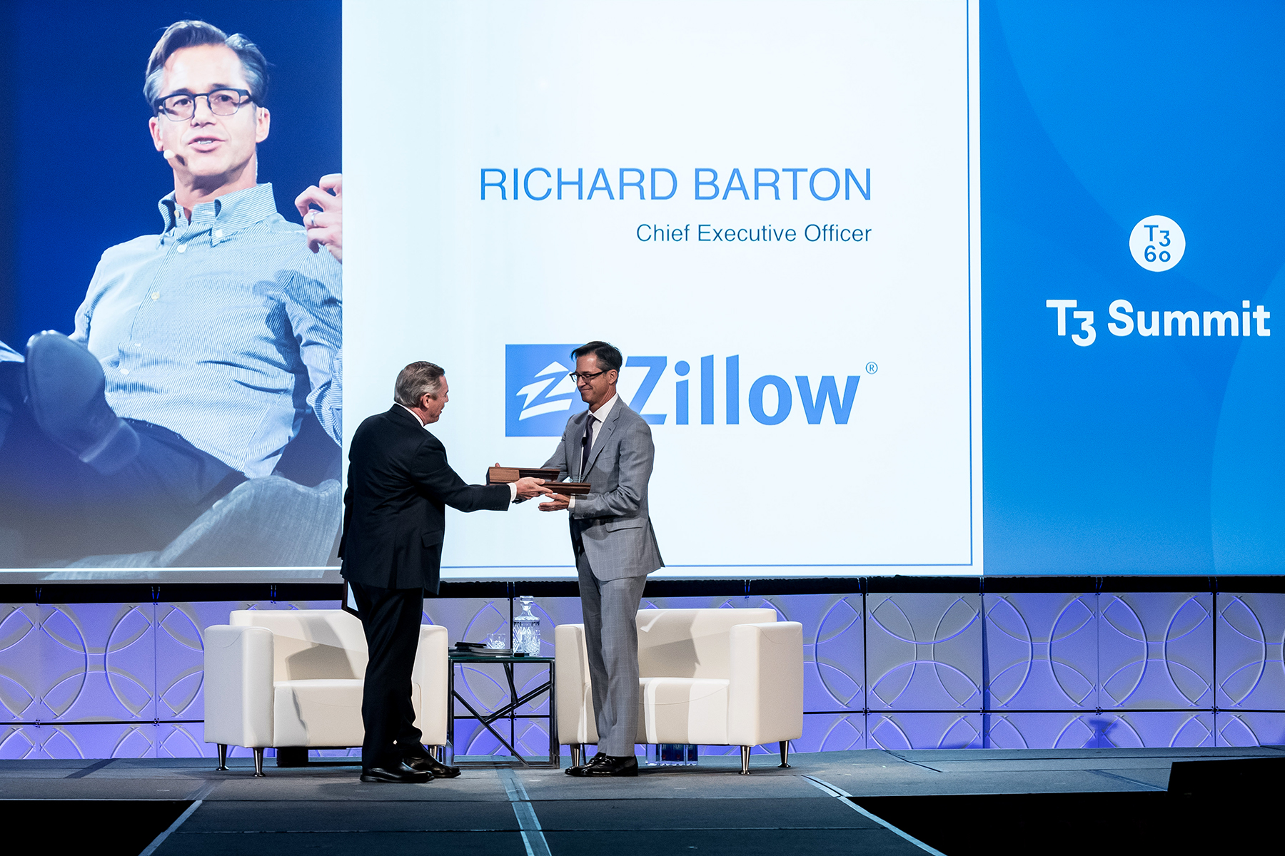 Stefan Swanepoel presents Richard Barton, CEO of Zillow with 2019 Visionary Award.