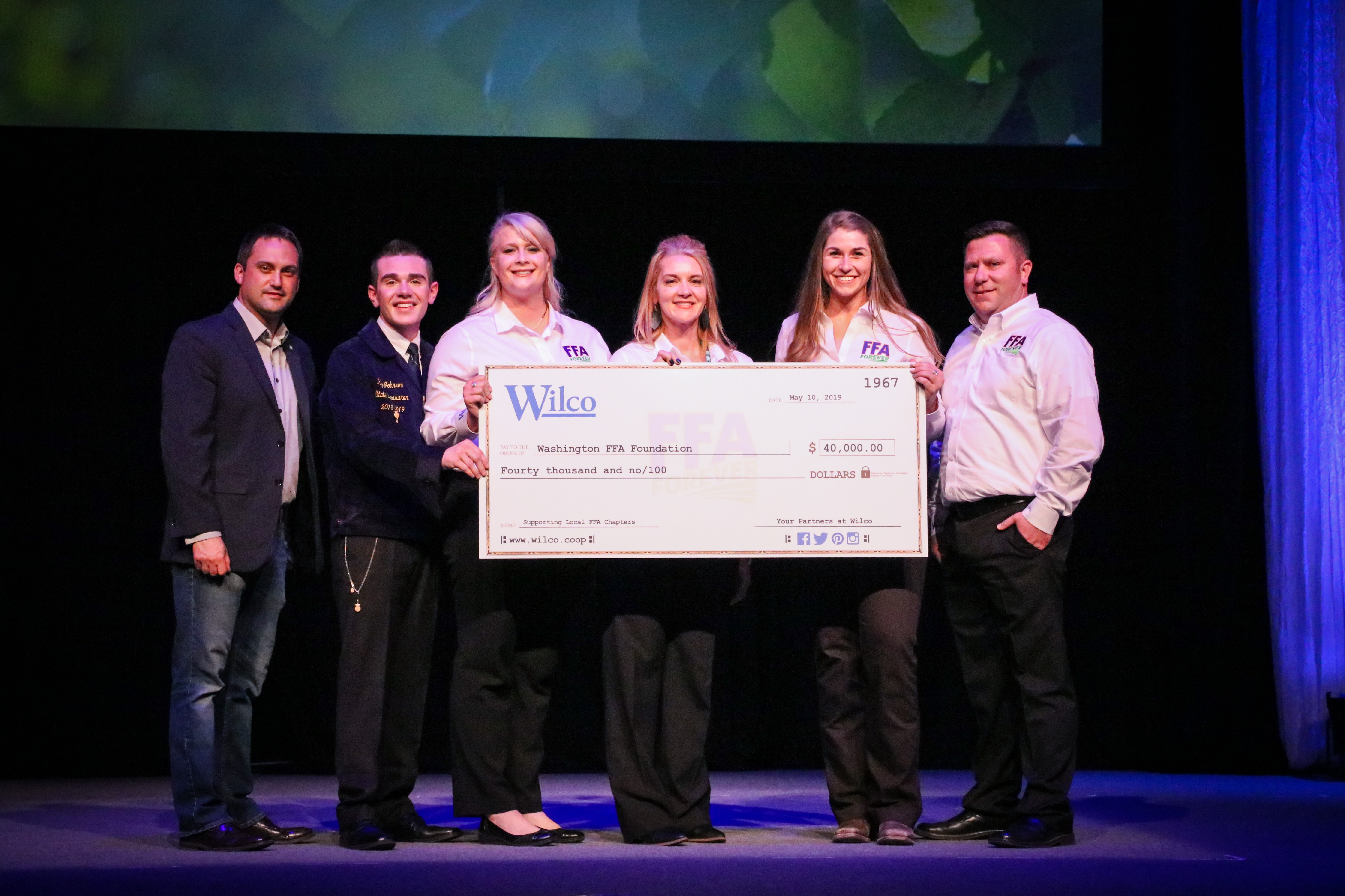 Wilco team members proudly present a check to the Washington FFA Foundation in Pullman, Washington