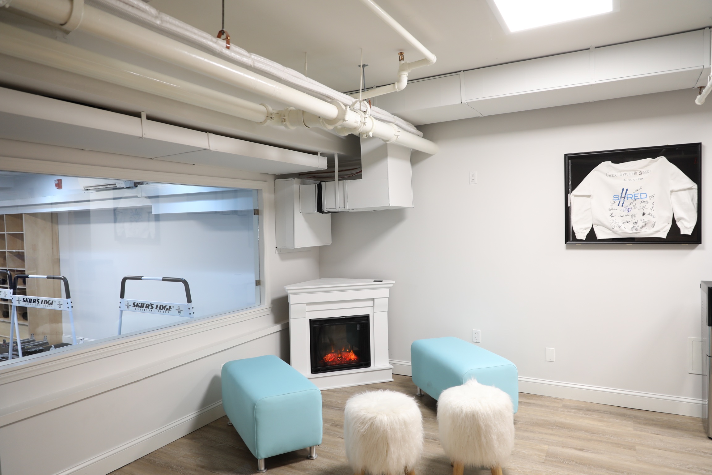 The SHRED fitness studio has a cozy ski lodge setting with a fireplace.