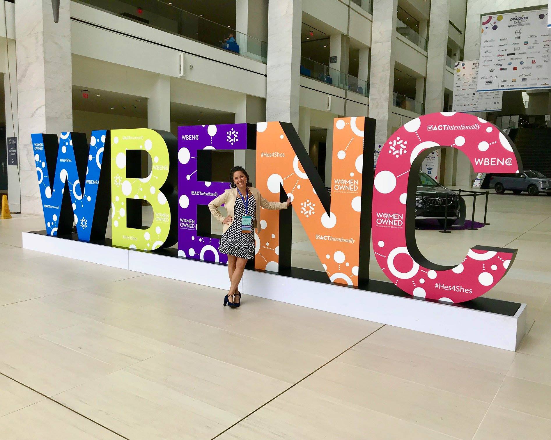 Gia Machlin with WBENC sign