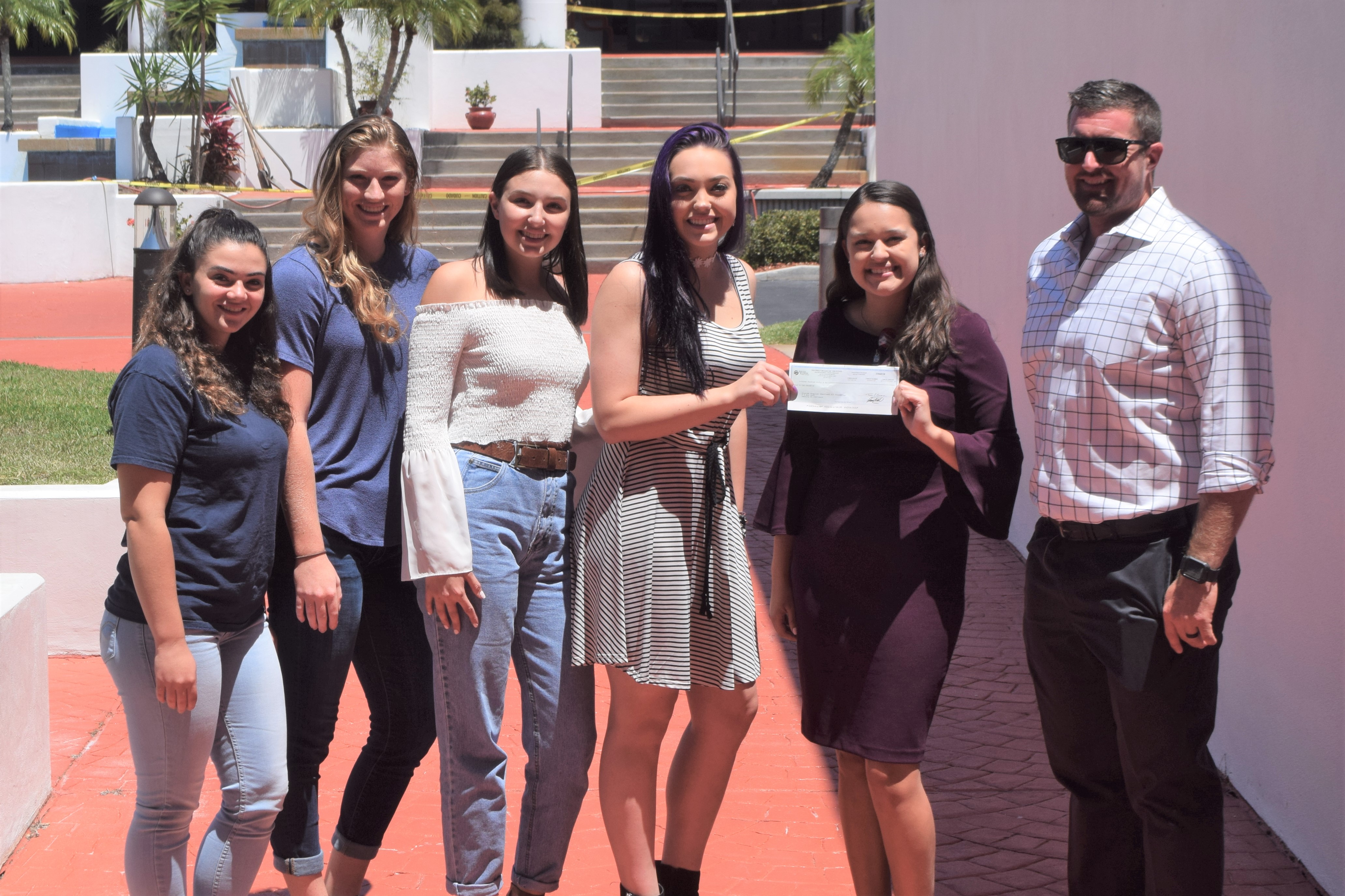 South Florida State College Student Government Association makes donation to AdventHealth Sebring to help provide free mammograms.