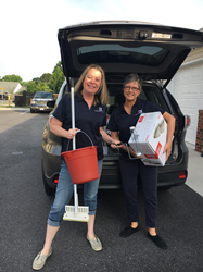 Drucker + Falk's Tarra Secrest and Kathy Flynn volunteering during the Hampton Roads Apartment Council's Day of Giving supporting Samaritan House