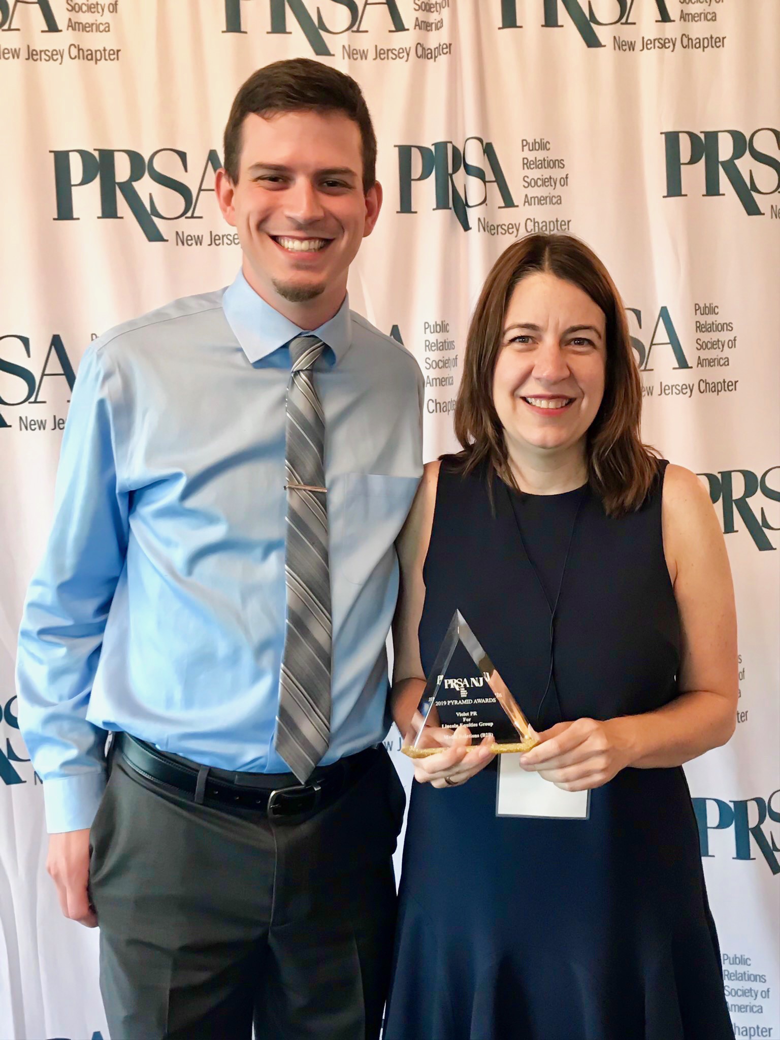 L-R: Dan Gunderman and April Mason of Violet PR are shown after winning a PRSA NJ Pyramid award on June 12, 2019.