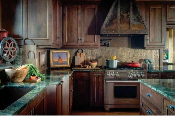 Billings, Montana-based Kibler & Kirch beautifully incorporates meaningful Western art throughout the home, including in the kitchen (photo by Audrey Hall).