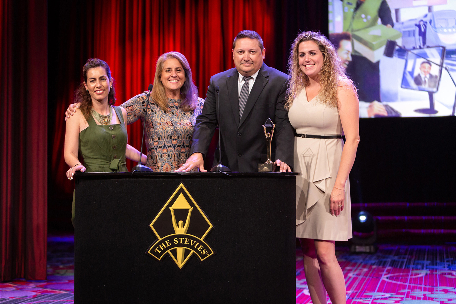 Bluewater Media CEO Andy Latimer and President of Media Gina Pomponi pose with representatives from SodaStream at the Stevie Awards