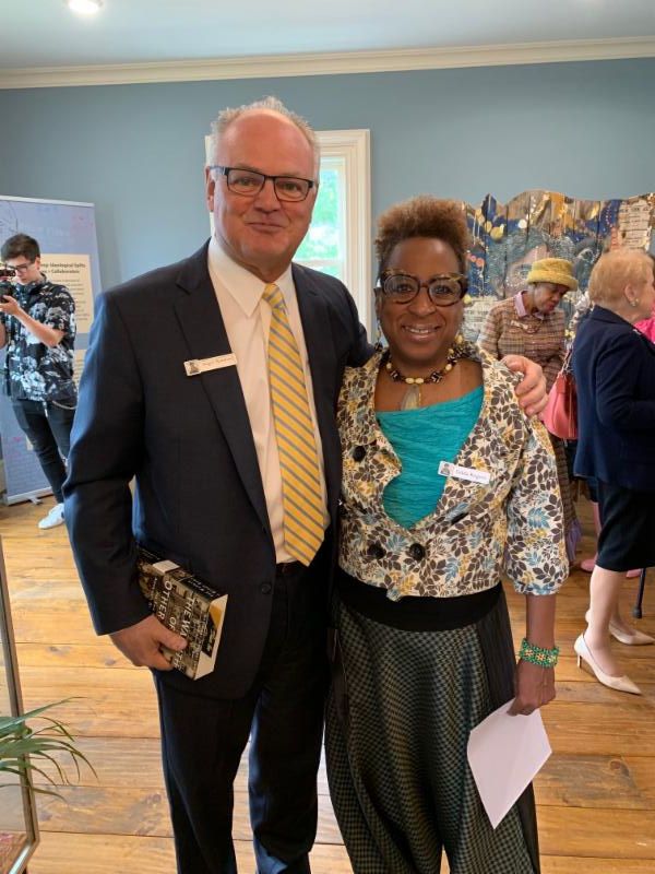 Roger Mumford (left) of Roger Mumford Homes, and Gilda Rogers, Vice President of the T. Thomas Fortune Foundation.