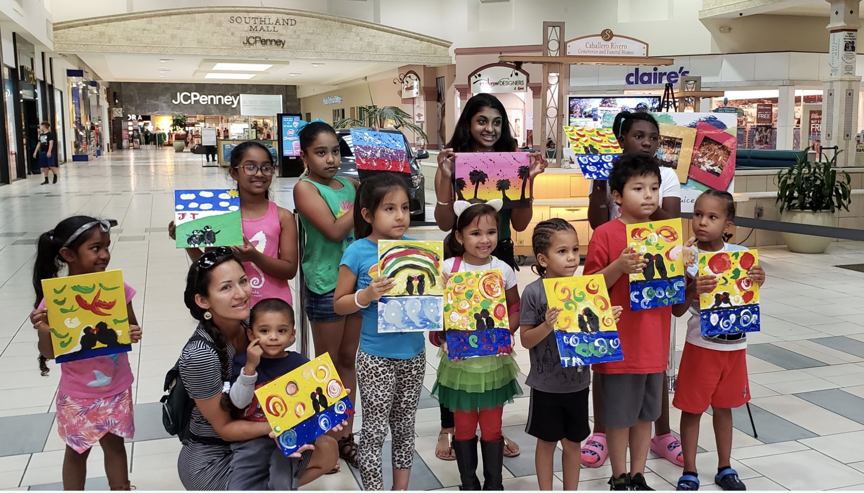 Kids learn how to create their own paintings at Art & Juice workshop at Southland Mall.