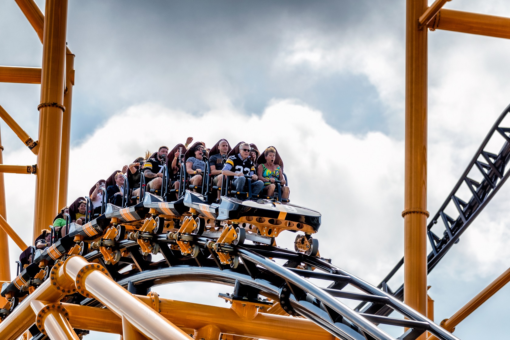 Four-time Super Bowl Champion Mike Wagner braces himself on The Steel Curtain roller coaster at Kennywood Park on July 12, 2019.