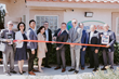 Ben Ives (center), flanked by RapidVisa Staff and members of the Las Vegas Metro, Asian, and Latin Chambers of Commerce attend a ribbon cutting ceremony during RapidVisa’s 10th anniversary and grand o