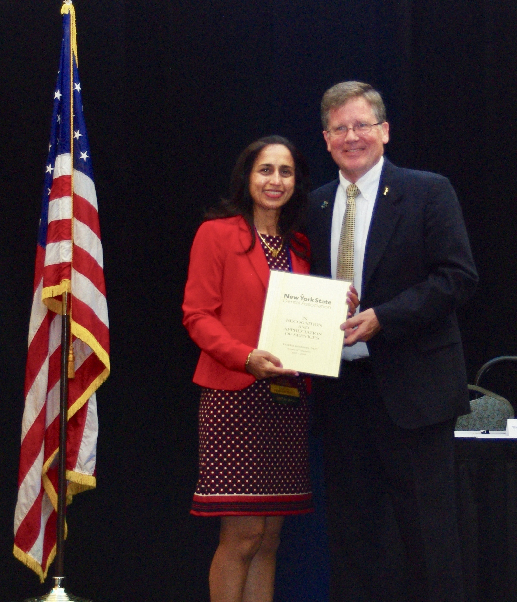 Dr. Prabha Krishnan receives her plaque in dedication of her service as a Trustee on the Board of the New York State Dental Association at the Hyatt Regency, Buffalo on June 9, 2019.