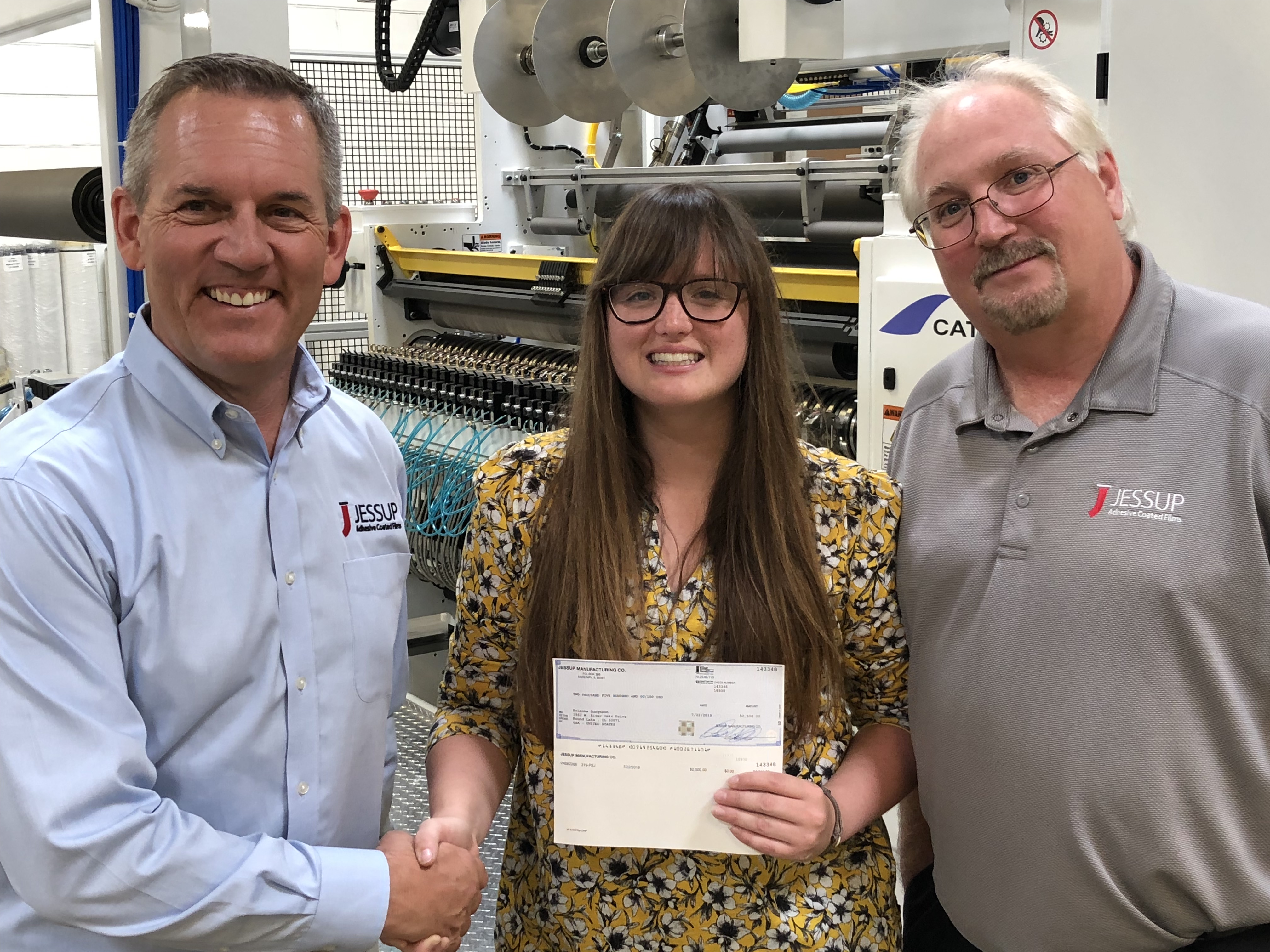 Brianna Burgeson of Round Lake, Illinois receiving a scholarship from Robert A. Jessup, President and CEO of Jessup Manufacturing.
