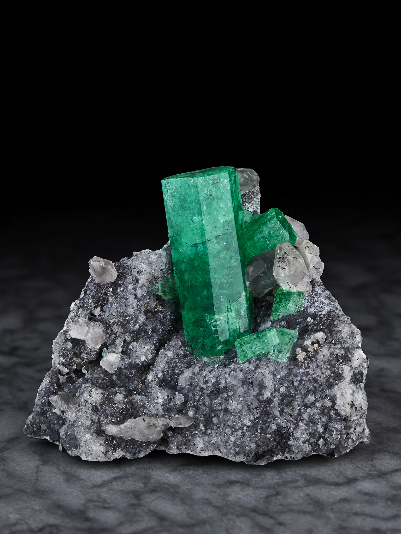 Emerald on Calcite, from the Coscuez Mine, Boyaca, Columbia. Dr. Stephen Smale Collection. Image by Evan D'Arpino.