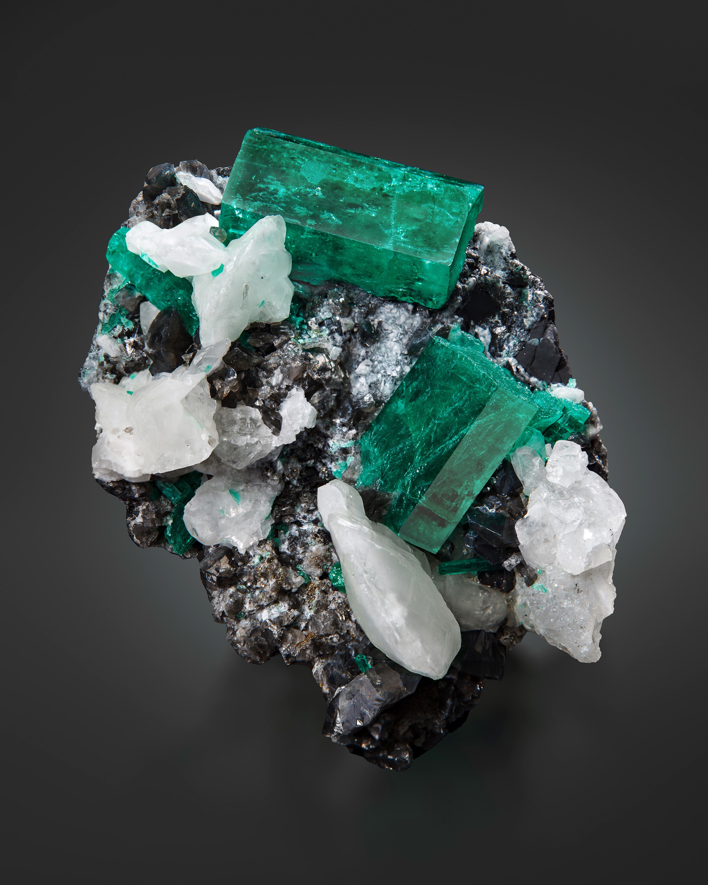 "The Yamile." Emerald on Calcite, from the Coscuez Mine, Boyaca, Columbia. Formerly in the  Víctor Carranza Niño collection, and currently in the collection of Ms. Lyda Hill. Image by Evan D'Arpino.