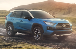 2019 Blue Toyota RAV4 Hybrid with a hill in background