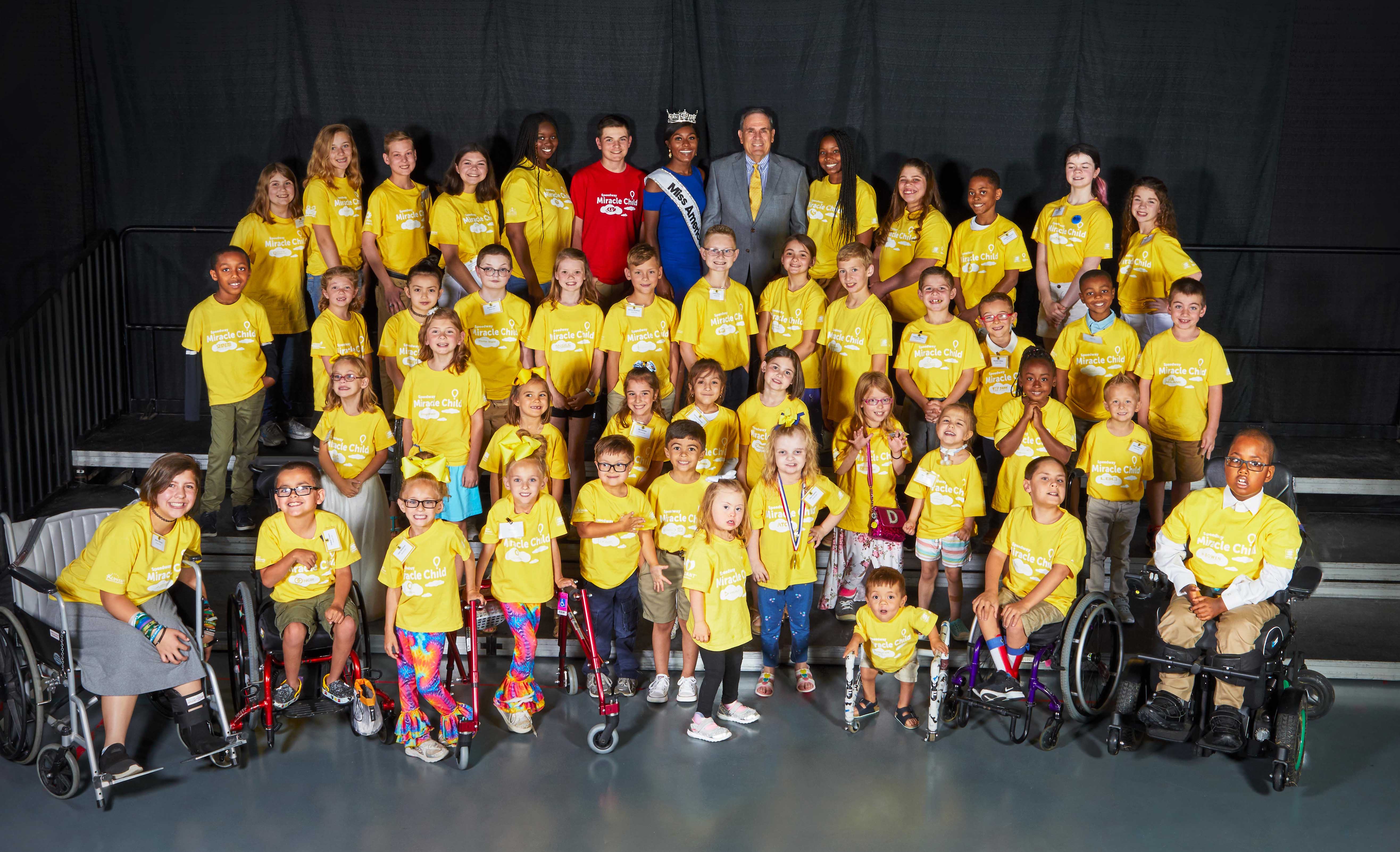 Miss America Nia Franklin and Tony Kenney, Executive Vice President, Speedway LLC pose with 43 Speedway Miracle Children