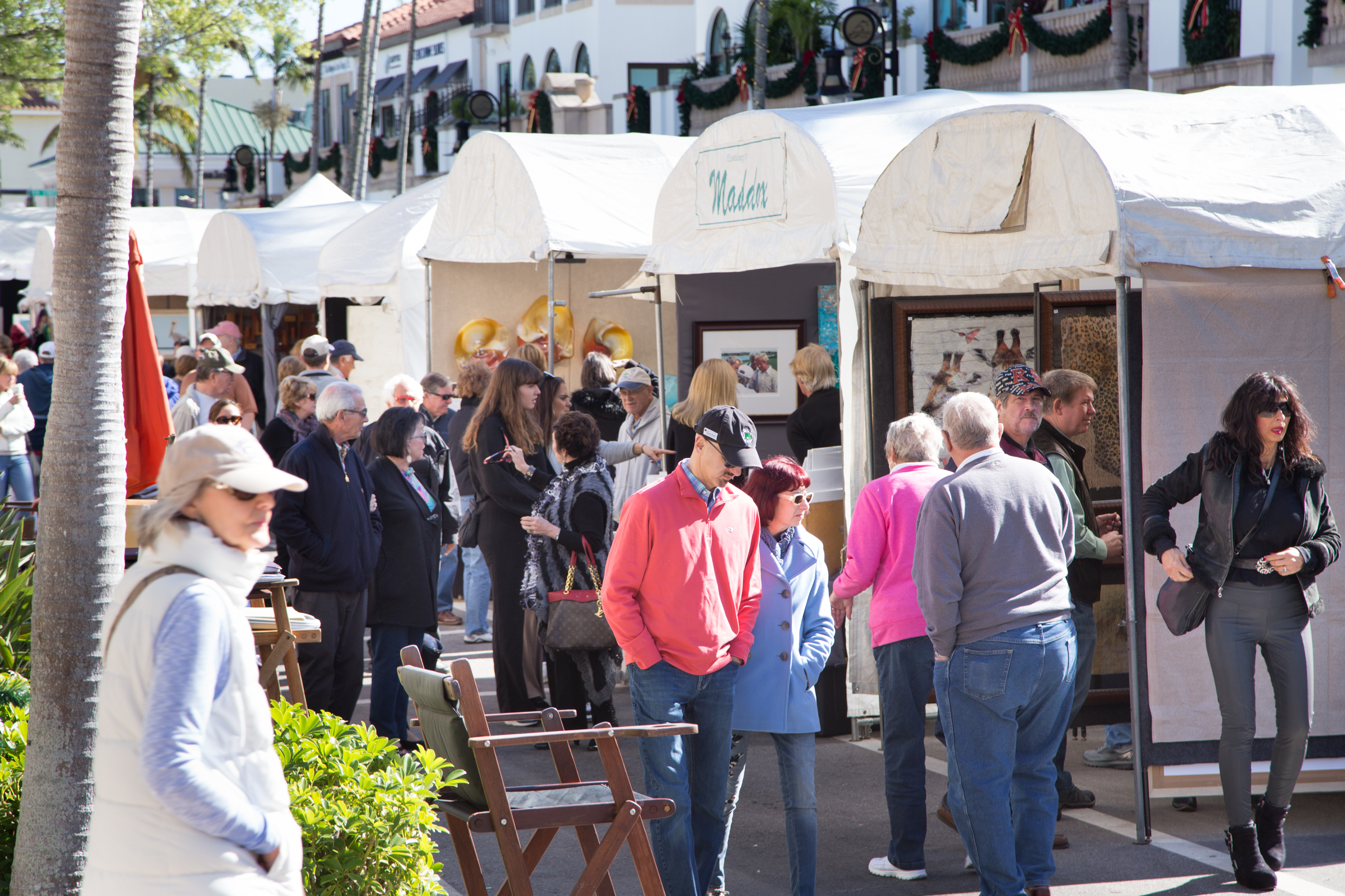 Attendees enjoy an outdoor art show, ranked as one of the nations' best, in Naples, Florida.