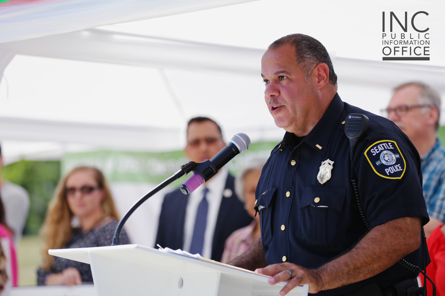 Lt. Martin Rivera of the Seattle Police Foundation, addressing the crowd at the Aid to Humanity event and thanking the FYM Foundation for its donation.