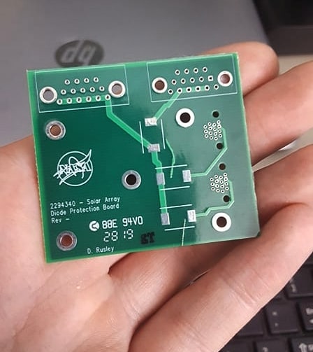 Dakotah Rusley, a graduate of SD Mines who now works at NASA, created this custom circuit board.  Credit NASA.