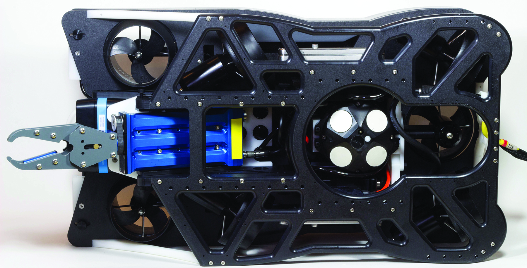 The bottom of the Defender pictured showing a payload of a Oculus 750D multibeam sonar, Inuktun rotating manipulator and a Nortek DVL used for autonomous control such as station keeping and waypoint f