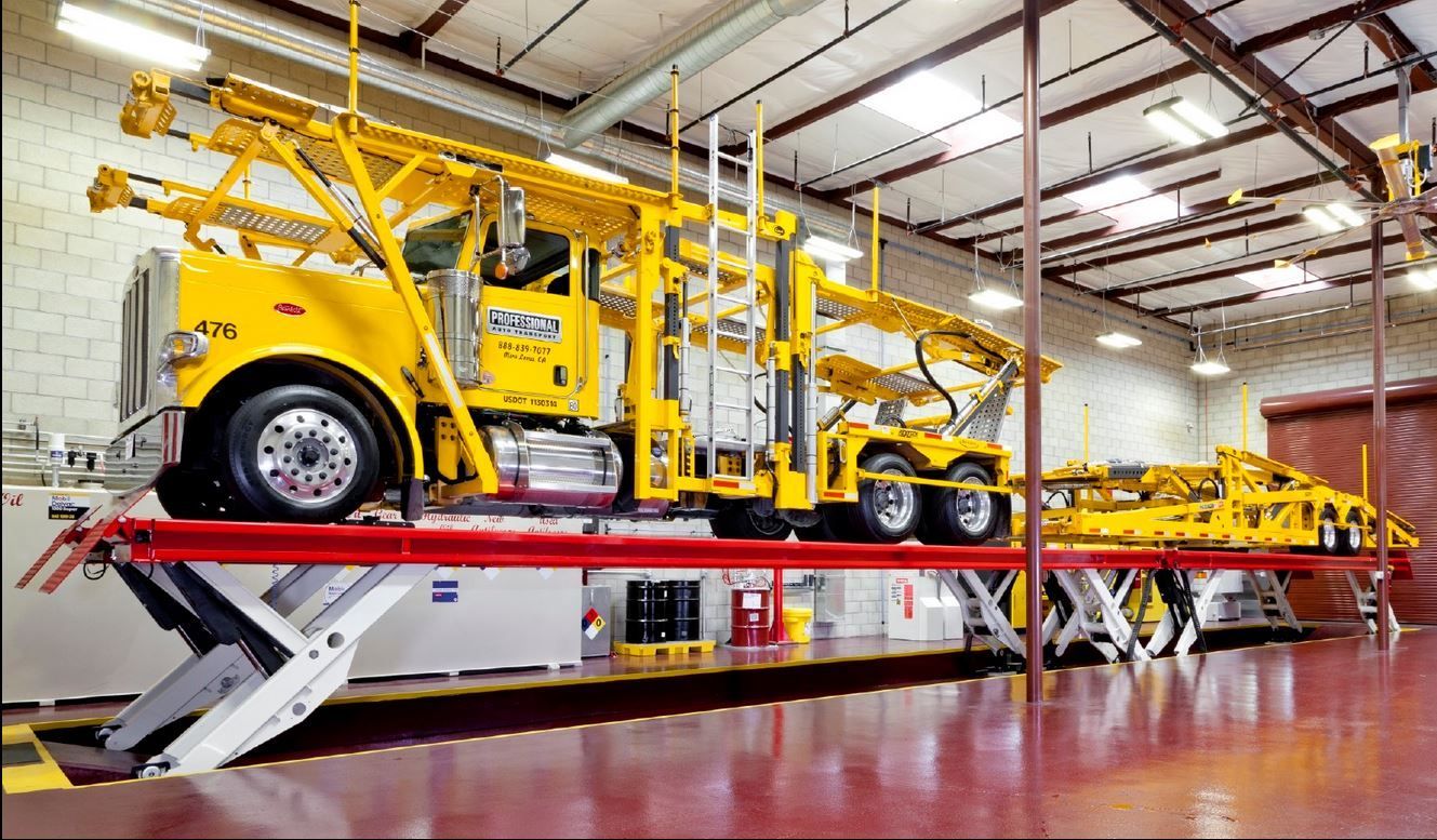 Platform lifts are ideal for quick roll-on, roll-off servicing. Shown here, the Stertil-Koni SKYLIFT in a tandem configuration.  Capacity: 156,000 lbs.