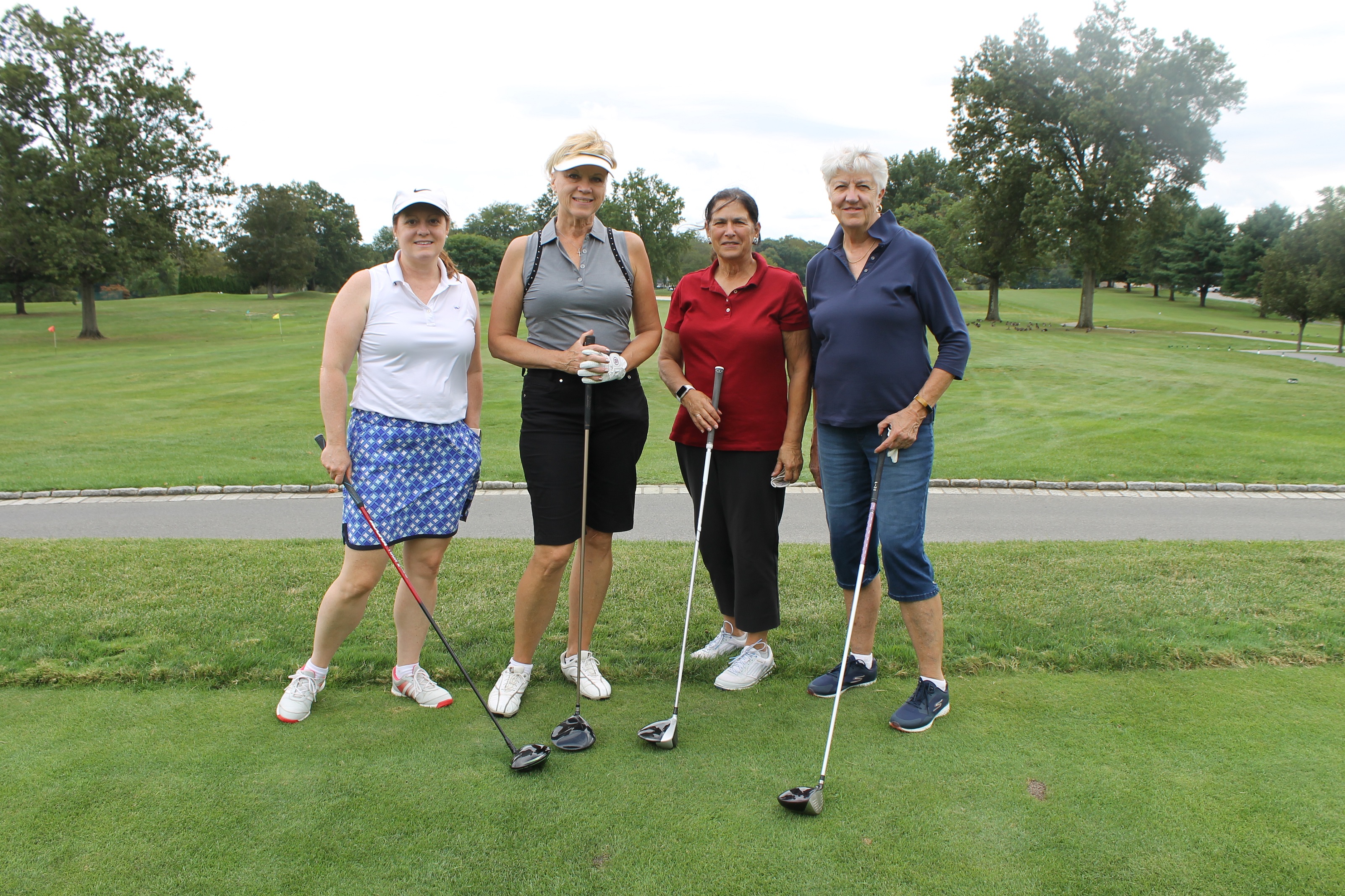Kathleen McArdle (right), board member, with her foursome at the HOW 17th Annual Golf Invitational.