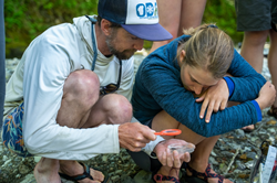 Professor Daryl Teittenen of SNC Tahoe at the river's edge, with a student scientist. Sierra Nevada College Science and Sustainability Department