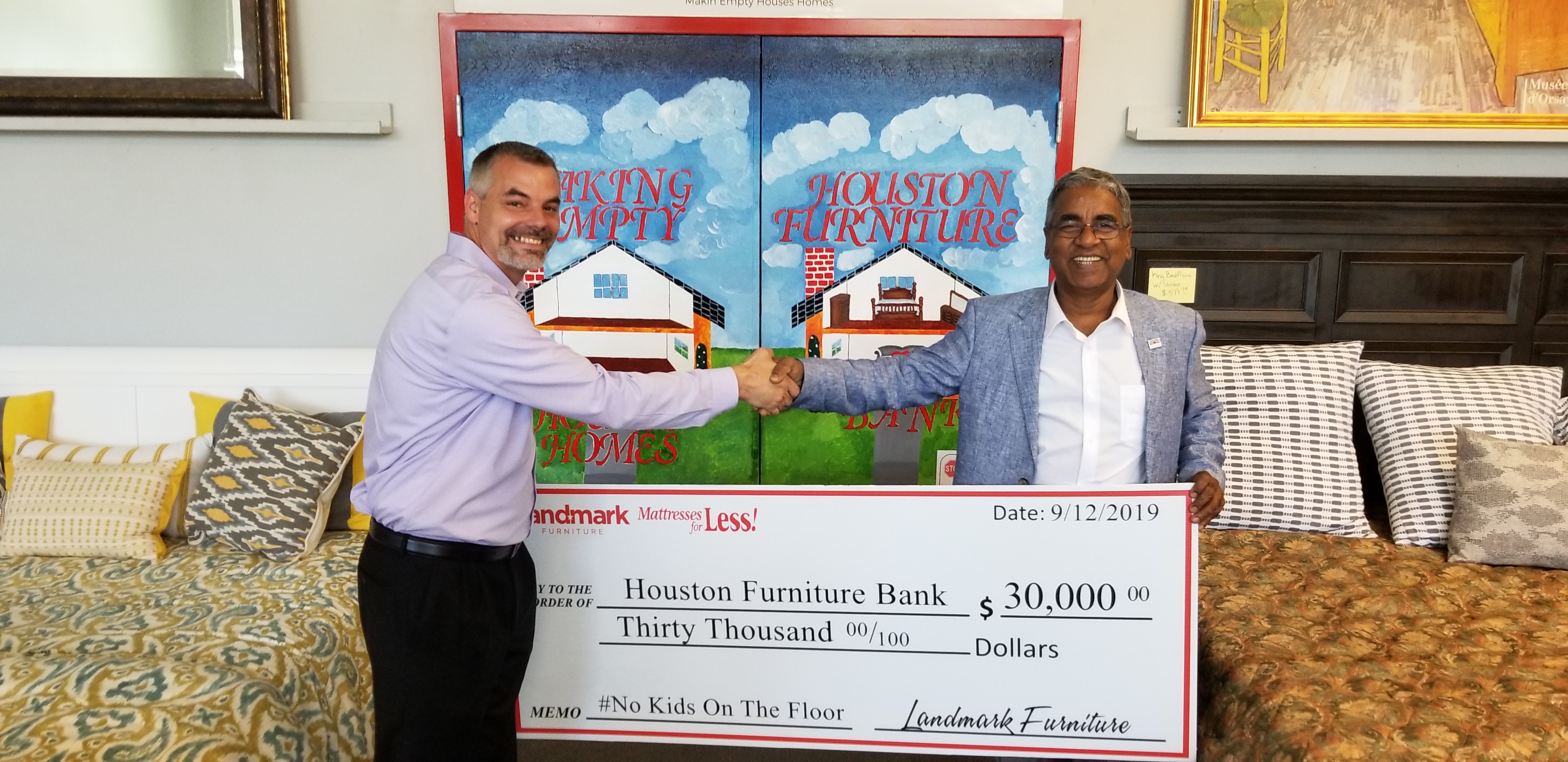 Brad Taylor handing off $30K Check to Houston Furniture Bank